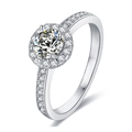 Elegant round moissanite ring in silver finish with pavé set diamond accents on a white base - US 5.25 / Round Wrapped-0.5ct