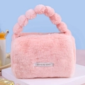 Pink plush cosmetics bag with pom-pom handles for high-capacity travel storage - Pink