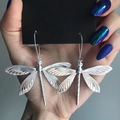 Minimalist silver dragonfly earrings with intricate wing details on black card - Earrings B (Large Silver Dragonfly Hook)
