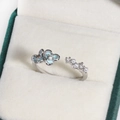 Detail of adjustable silver ring with blue enamel flowers, pearls, and zircons - Light Blue Flower Beaded Row (Platinum Color 7)