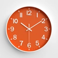 Modern 12-inch round wall clock featuring a bright orange dial with white frame - Orange Red