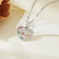 Macro shot of silver heart pendant featuring multi-colored cubic zirconia stones on silk - Silver Colorful Hollow Zircon Necklace (T021)