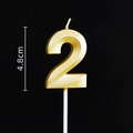Detail of golden number 2 birthday candle with 4.8cm height and metallic faceted design - Gold Number 2