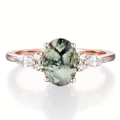 Rose gold ring with large oval faux stone and marquise accents on white background - US 6 / Rose Gold