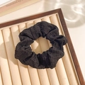 Floral lace trim scrunchie in black textured fabric with a stylish ribbon bow design - Black Seersucker