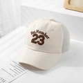 Close-up of beige mesh baseball cap with brown Number 23 embroidery on white stairs - 50cm (1-3 Years) / Style 23-Beige