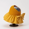Macro detail of yellow sun hat featuring knit crown, embossed brim, and large bow decoration - M (56-58cm) / Yellow