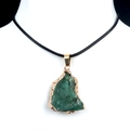 Irregular green crystal stone pendant with gold edge and black necklace cord on model - Green Aventurine