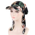Detailed view of long tail floral headscarf cap with leaf pattern on female model - Black Green Flower