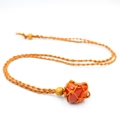 Handmade woven necklace with a polished orange crystal stone in a brown cord net - Red Agate