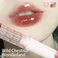 Cappuvini water gloss lip glaze in Chestnut Oz shade, a milky tea nude color on lips - 6# Chestnut Fairy Brown