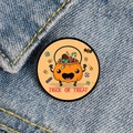 Detail of Halloween enamel pin with Trick or Treat pumpkin candy bucket on denim - Anthropomorphic Pumpkin Candy Bucket Style (XZ6940)