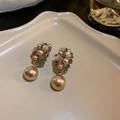 Detail of vintage gold earrings with zircon flowers and a large pearl pendant - Coffee Flower French Court Style