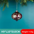 Burgundy Christmas glass ball ornament with gold glitter patterns hanging on pine needles - Wine Red Gold Glitter Ball Style 08