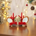 Christmas reindeer antler hair clips with red bows and gold leaves on wood surface - Red Bow Antlers