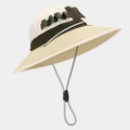 Detail of outdoor sun hat featuring straw brim, top fabric stitching, and adjustable chin strap - Beige Military Green Patchwork
