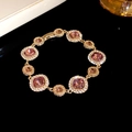 Vintage gold-plated bracelet with pink square gemstones and brilliant micro-pave crystals - Gold-Purple