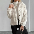 Detail view of white cable knit fleece jacket featuring textured fabric and dark buttons - S / White