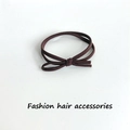 Elastic brown hair tie featuring a double-loop bow design and ribbed knit texture - 1 Piece / Dark Coffee