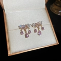 Detail of pink flower earrings with teardrop gemstone in a jewelry box - 23# Silver Earring Post - Gold-tone Pink Teardrop Flower