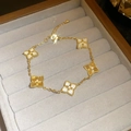 Golden five-clover bracelet featuring white mother-of-pearl and textured metal charms - Gold Zirconia Textured Clover Bracelet