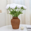 Handcrafted white knitted rose in a brown wicker vase for elegant home decor - White