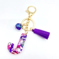 Letter J resin keychain with purple tassel and colorful glitter flakes inside - Letter J