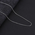Macro close-up showing the fine texture and silver luster of a minimalist snake chain necklace - Silver Round Snake Chain 45+5cm