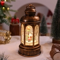 Detalle de farol de Navidad de bronce vintage con Papá Noel y purpurina dorada brillante - Papá Noel con Farola