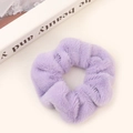 Soft plush scrunchie in light purple faux fur with fluffy texture for hair styling - Lavender