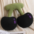 Cartoon cherry plush pillow in black and purple finish on beige knit background - Black