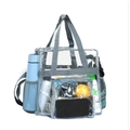 Detailansicht der transparenten Reisetasche mit grauem Rand und seitlichen Netztaschen - Grau