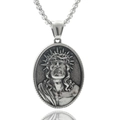 Macro shot of silver oval stainless steel pendant featuring vintage Jesus relief carving - Jesus Crown of Thorns