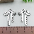Silver hollow bow charm for jewelry making shown with metric ruler for 2.5cm scale - Lace Pattern Bowknot - Silver (21389)