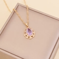 Golden teardrop necklace with purple gemstone and small diamonds on twist chain - Purple