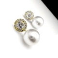 Elegant gold earrings featuring micro-set zircon accents and large white round pearls - Gold