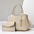 Detail of beige woven texture tote set with gold hardware and removable strap - White