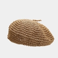 Close-up of hand-woven breathable straw beret with detailed spiral crochet texture - One Size / Khaki