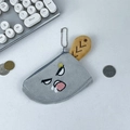 Macro shot of cleaver-shaped plush coin purse showing gray blade and brown handle textures - Funny Sassy Expression