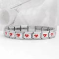 Macro shot of stainless steel Italian charm bracelet with red enamel heart patterns - Cupid's Arrow-Red (18 Links)