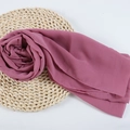 Elegant dusty pink chiffon hijab scarf with fine edges on a natural woven mat - 103