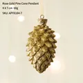 Décoration de sapin de Noël en forme de pomme de pin or rose avec paillettes 4x7cm - Pomme de Pin Dorée