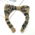 Detail of leopard print plush cat ear headband with soft faux fur texture on white background - Cat Ear / Short / Leopard Print