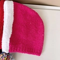 Macro detail of plush knit hat with colorful pom-pom trim and soft fleece texture - Rose Red with White Edge