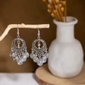 Bohemian silver earrings with hollow patterns on a rustic wooden branch display - E2874-2/Spiral Ring Tassel