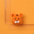 Handmade crochet tiger head keychain in orange yarn, measuring approximately 4cm by 4.5cm - Orange Tiger Head Pendant