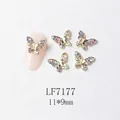 Detail of 3D gold butterfly nail charm with zircon inlays and 11x9mm size display - Gold Aurora Butterfly with Gold Edge (7177)
