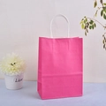 Close-up of pink kraft paper gift bag with durable white twisted rope handles detail - Rose Red / 33*26*12
