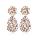 Detail of rose gold teardrop earrings featuring crystal rhinestones on a white background - Clip-on Earrings / AB Color