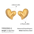 Detail view of puffy gold heart earrings with size measurements in stainless steel - Gold (YYE023562-G)